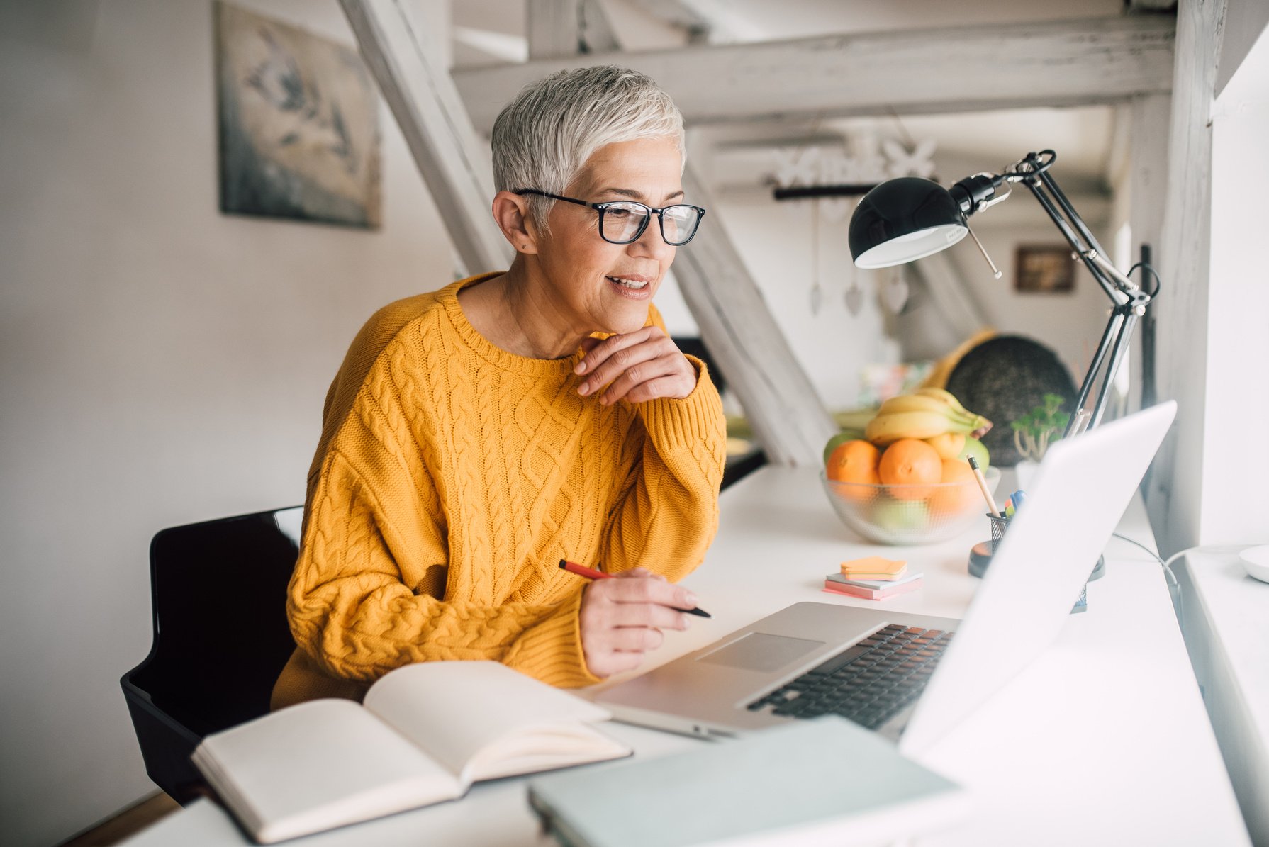 Older woman working on laptop